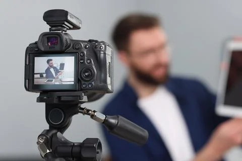 Technology blogger explaining something while recording video at home, focu.. Stock Photos