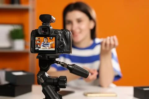 Technology blogger explaining something while recording video at home, focu.. Stock Photos
