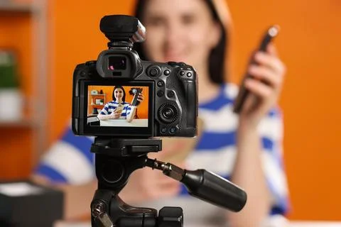 Technology blogger explaining something while recording video at home, focu.. Stock Photos
