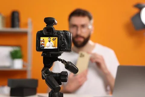 Technology blogger explaining something while recording video at home, focu.. Stock Photos