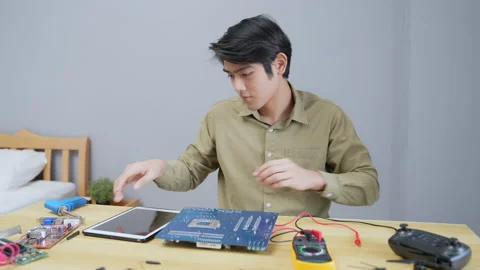 Technology concept of 4k Resolution. Asian man checking the electrical circui Stock Footage 203981876