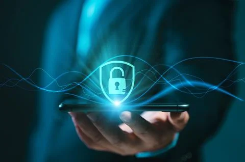 Technology Concept of Cybersecurity. A businessman is using a smartphone to.. Stock Photos