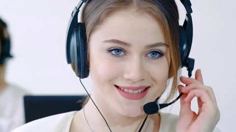 Technology concept - helpline operator with headphones in call centre Stock-Footage 61303955