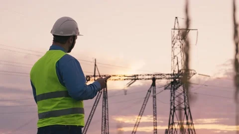 Technology concept with high voltage power lines. electrical engineer helmet Stock Footage 171321566
