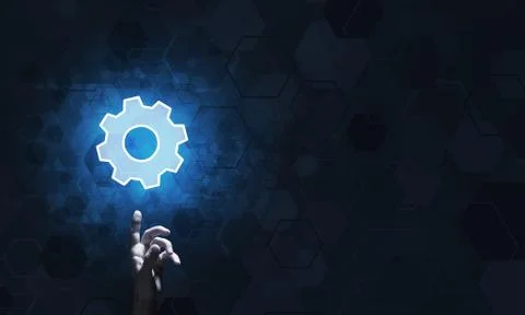 Technology conceptual image with gear digital symbol on dark background Stock Photos