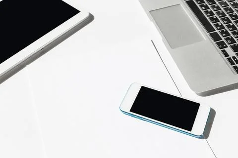 Technology devices are arranged on a clean workspace during a productive work Stock Photos