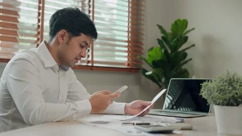 Technology for easy Life and scan. Asia men use telephone scan QR code for pa Video stock 164664468