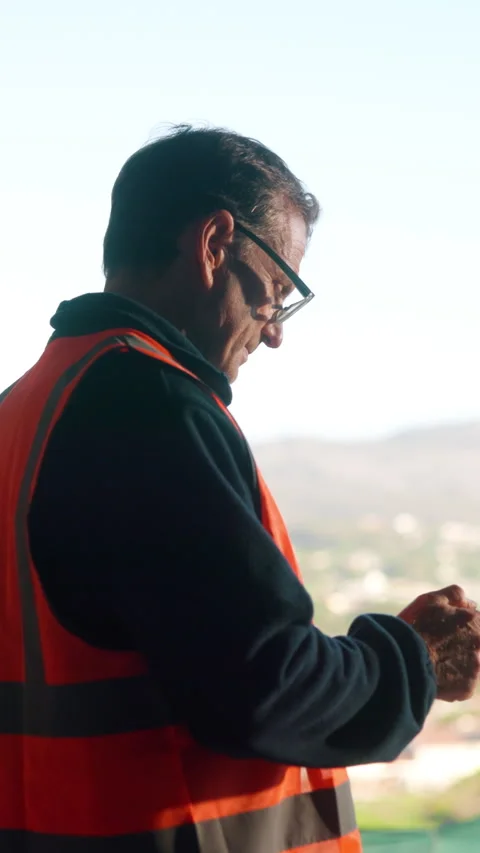 Technology, engineer or mature man on construction site with communication Stock Footage 336188432