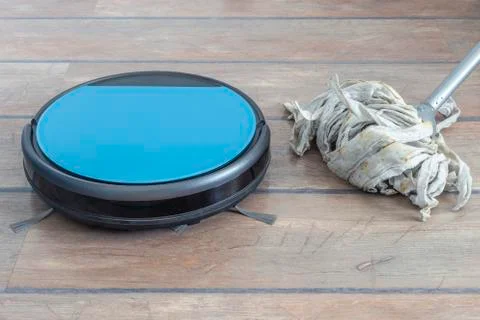 Technology evolution. Robot vacuum cleaner and mop next to each other Stock Photos