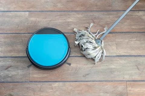 Technology evolution. Robot vacuum cleaner and mop next to each other Stock Photos