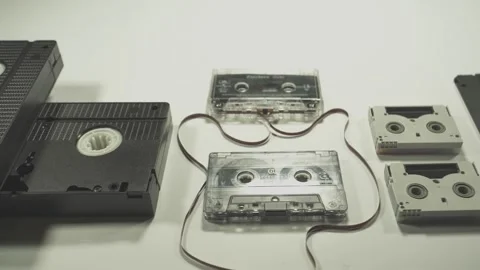 Technology evolving from vhs to memory stick on white background Stock Footage 295227483