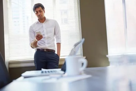 Technology has completely changed the way I do business. a businessman working Stock Photos