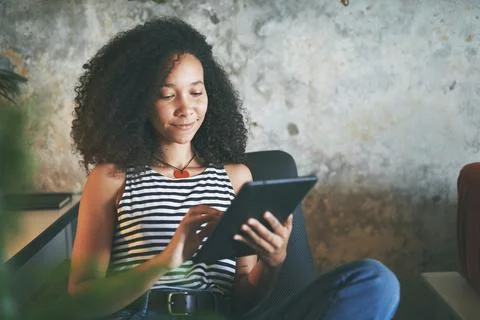 Technology helps her keep in touch with friends Stock Photos