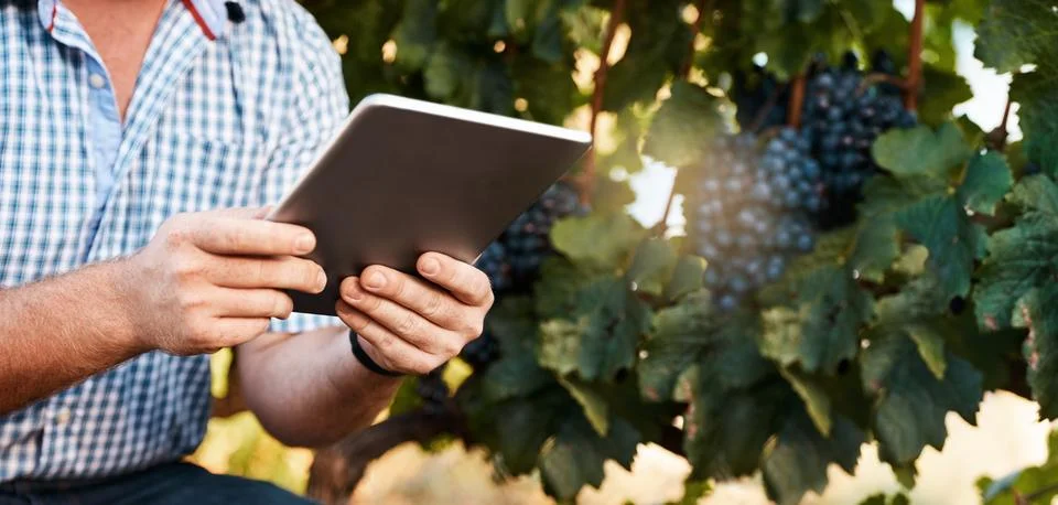 Technology helps him get through his tasks quicker. Closeup shot of a farmer Stock Photos