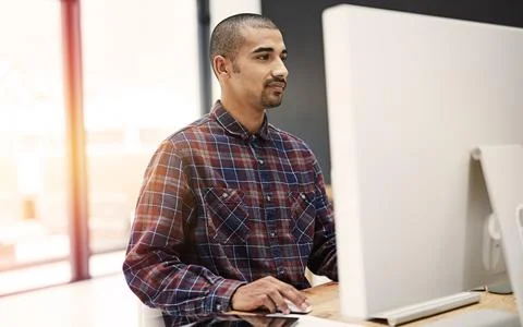 Technology helps increase the pace of doing business. a young entrepreneur Stock Photos