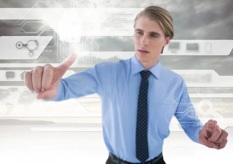 Technology interface and Businessman touching air in front of clouds Stock Photos