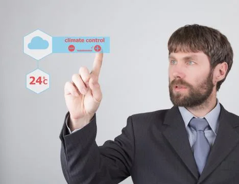 Technology, internet and networking concept - businessman adjusts ambient Photos