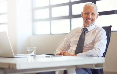Technology keeps me connected to my competitors. Portrait of a mature Stock Photos