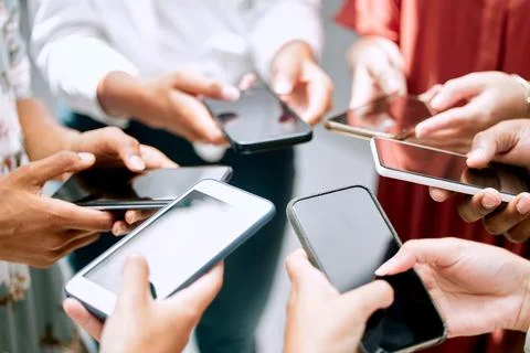 Technology makes reaching clients easier. a group of unrecignizable Stock Photos