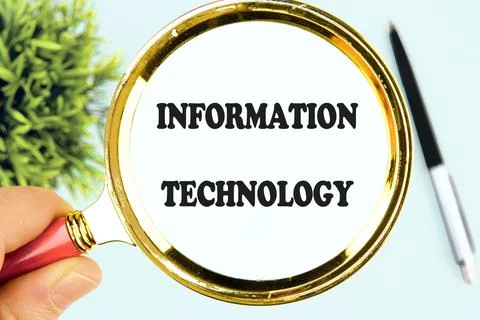 Technology Management word INFORMATION TECHNOLOGY through a magnifying glass, Stockfoto's