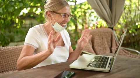 Technology old age people concept - elderly senior woman protective face mask Stock Footage 141576957