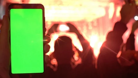 Technology party concept man’s hand hold smartphone with greenscreen chromakey Stock Footage 118134588