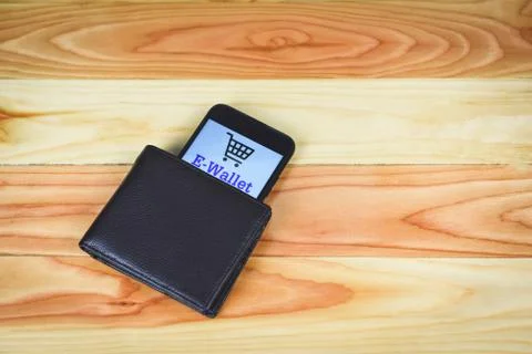 Technology pay e wallet app on smartphone with brown brown wallet - Mobile pa Stock Photos