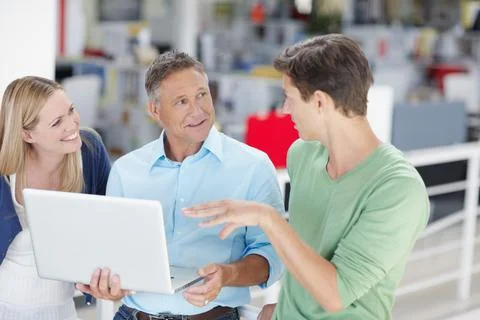Technology plays an integral part in the functioning of a business. Three work Stock Photos