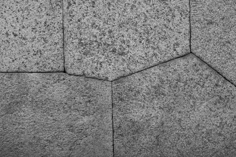The technology of polygonal masonry at the base of an ancient structure. Stock Photos