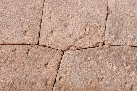 The technology of polygonal masonry at the base of an ancient structure. Stock Photos