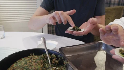 Technology of preparing chinesse dumplings with spinach by handmade Stock Footage 95624813