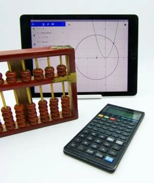 Technology progress concept: vintage abacus, calculator, software Stock Photos