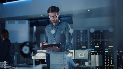In Technology Research Facility: Chief Engineer Stands in the Middle of the Lab Stock Footage