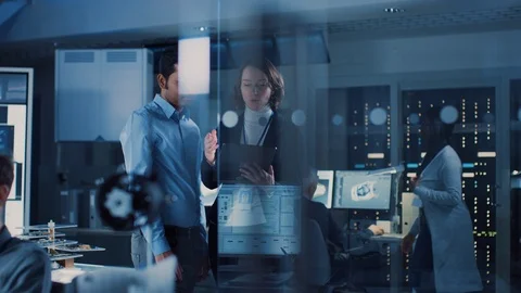 In Technology Research Facility Female Project Manager Talks With Chief Engineer Stock Footage 104793950