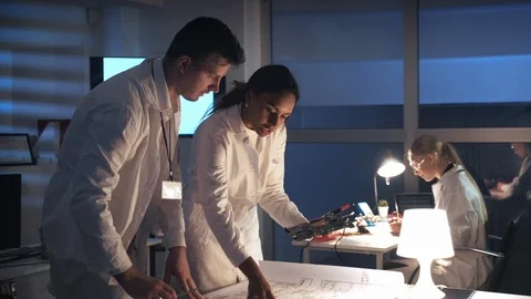 Technology Research Laboratory: Mixed race electronics engineers in white coats Video stock 112872914