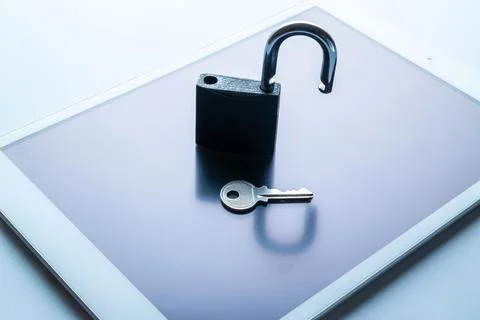 Technology security. Modern space grey mobile phone with padlock, key on whit Stock Photos