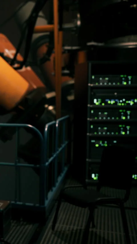 Technology setup in a server room with equipment and a work area visible Stock Footage 341054103