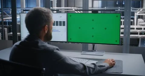 Technology Specialist Using Replaceable Screen for Network Administration Foto stock