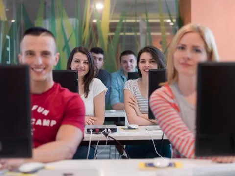 Technology students group in computer lab school  classroom Foto stock