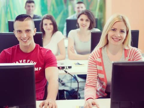 Technology students group in computer lab school  classroom Foto stock