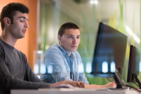 Technology students group working  in computer lab school  classroom Stock Photos