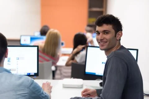 Technology students group working  in computer lab school  classroom Foto stock