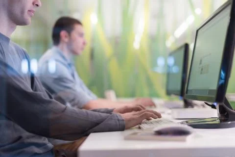 Technology students group working  in computer lab school  classroom Stock Photos