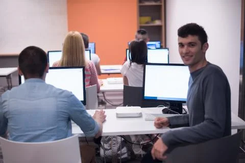 Technology students group working  in computer lab school  classroom Foto stock