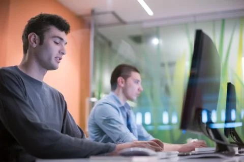 Technology students group working  in computer lab school  classroom Foto stock