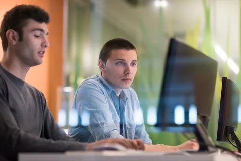 Technology students group working in computer lab school classroom technol... Stock Photos