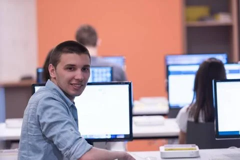 Technology students group working in computer lab school classroom technol... Stock Photos