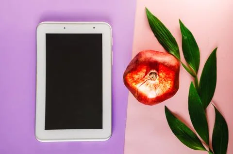 Technology, tablet with wireless Internet. pomegranate vitamin for the body Fotos Stock