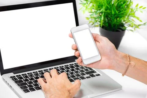 Technology tools at work with a laptop and smartphone in a modern workspace Stock Photos