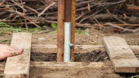 Technology. two men drilled a water well with an improvised drilling rig Stock Footage 107898857